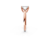 Rose gold Three-Stone Emerald Cut Cut Diamond Ring with Trillion Side Stones and Four-Prong Setting_5