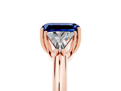 Rose gold Three-Stone Emerald Cut Cut Diamond Ring with Trillion Side Stones and Four-Prong Setting_5