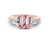 Rose gold Three-Stone Emerald Cut Cut Diamond Ring with Trillion Side Stones and Four-Prong Setting