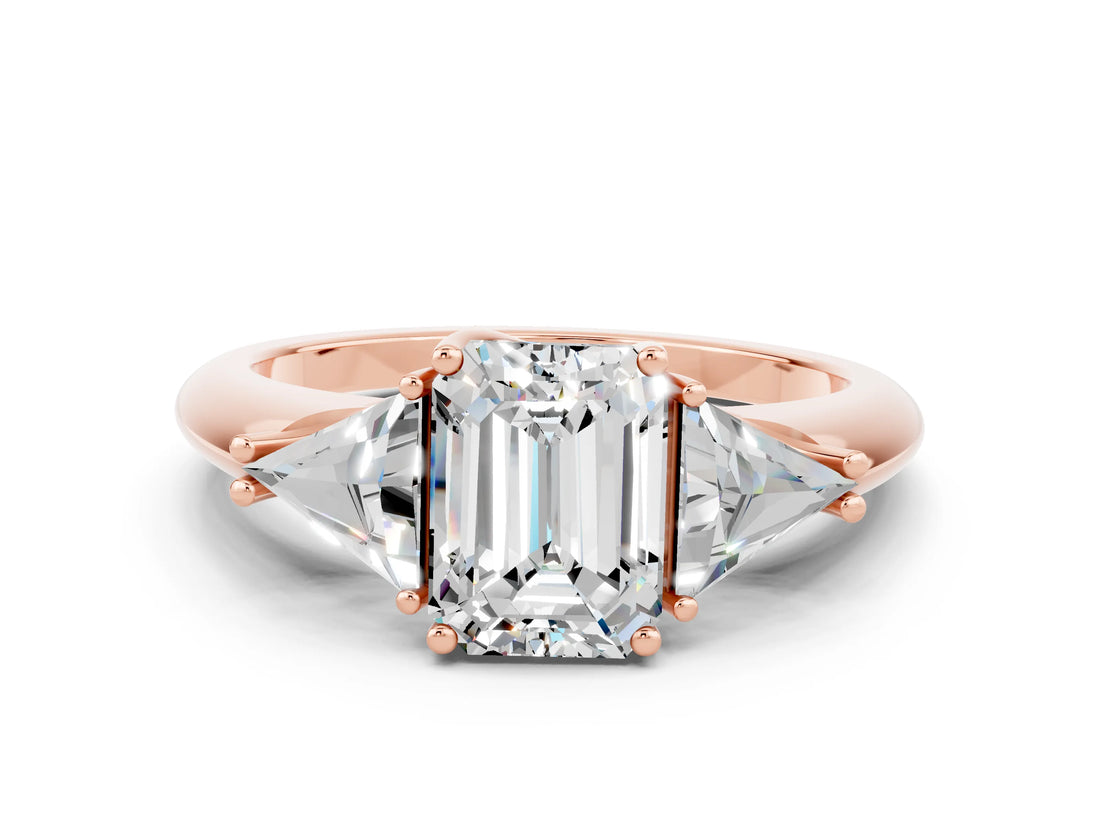 Rose gold Three-Stone Emerald Cut Cut Diamond Ring with Trillion Side Stones and Four-Prong Setting