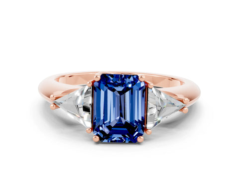 Rose gold Three-Stone Emerald Cut Cut Diamond Ring with Trillion Side Stones and Four-Prong Setting