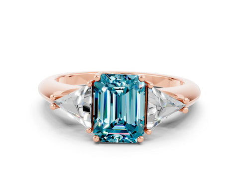 Rose gold Three-Stone Emerald Cut Cut Diamond Ring with Trillion Side Stones and Four-Prong Setting