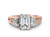 Rose gold Three-Stone Emerald Cut Cut Diamond Ring with Trillion Side Stones on a Split Shank Band_19