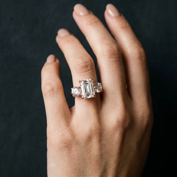 Rose gold Three-Stone Emerald Cut Diamond Engagement Ring with Prong Setting on a White Gold Band