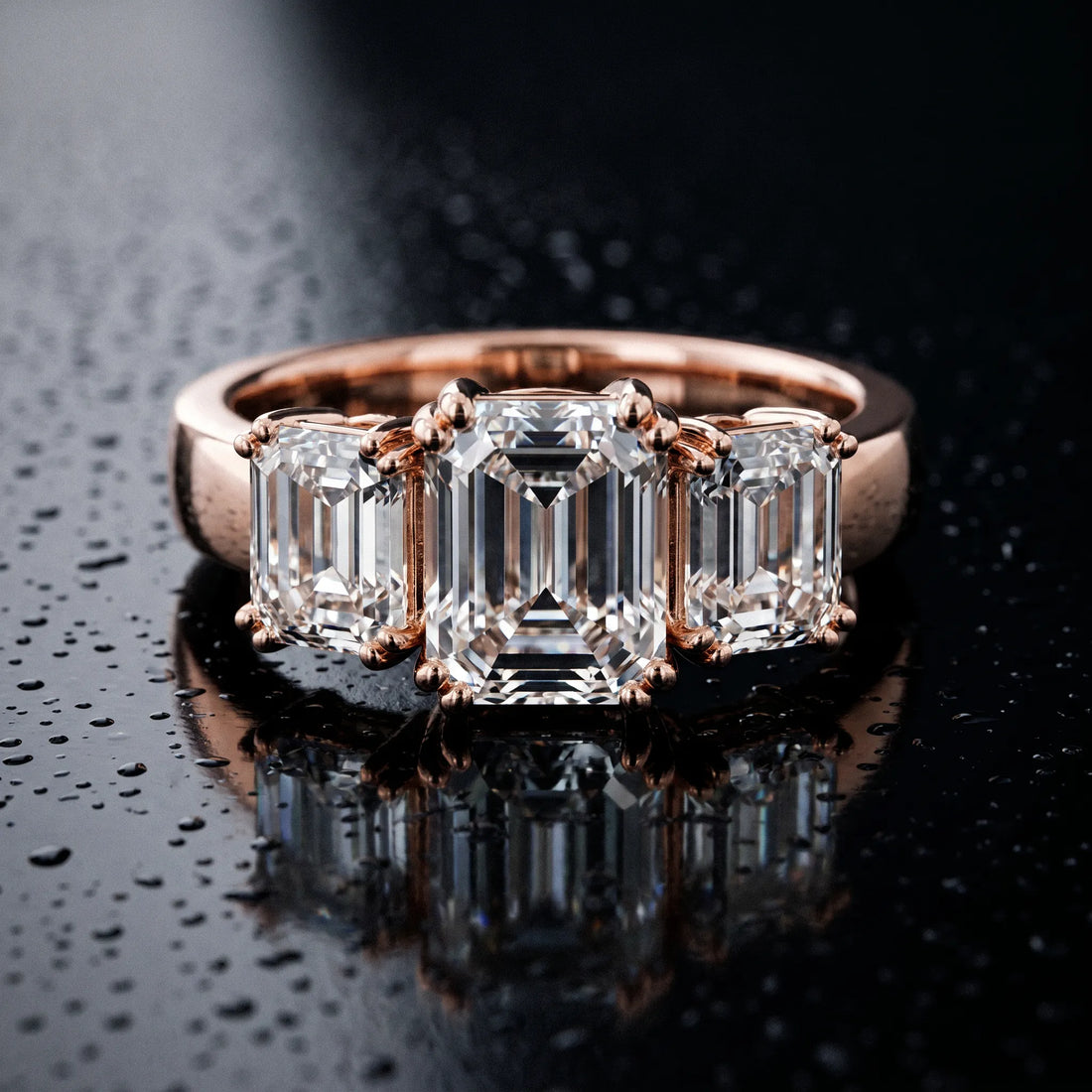 Rose gold Three-Stone Emerald Cut Diamond Ring with Channel Set Band and Four-Prong Setting_24