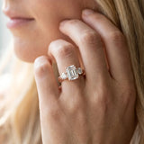 Rose gold Three-Stone Emerald Cut Diamond Ring with Channel-Set Band and Prong Setting_20