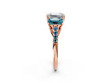 Rose gold Three-Stone Emerald Cut Diamond Ring with Round with Blue Topaz side stone Pavé Band and Prong Setting_2