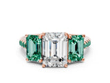 Rose gold Three-Stone Emerald Cut Diamond Ring with Round with Green Sapphire side stone Pavé Band and Prong Setting