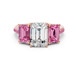 Rose gold Three-Stone Emerald Cut Diamond Ring with Round with Pink Sapphire side stone Pavé Band and Prong Setting