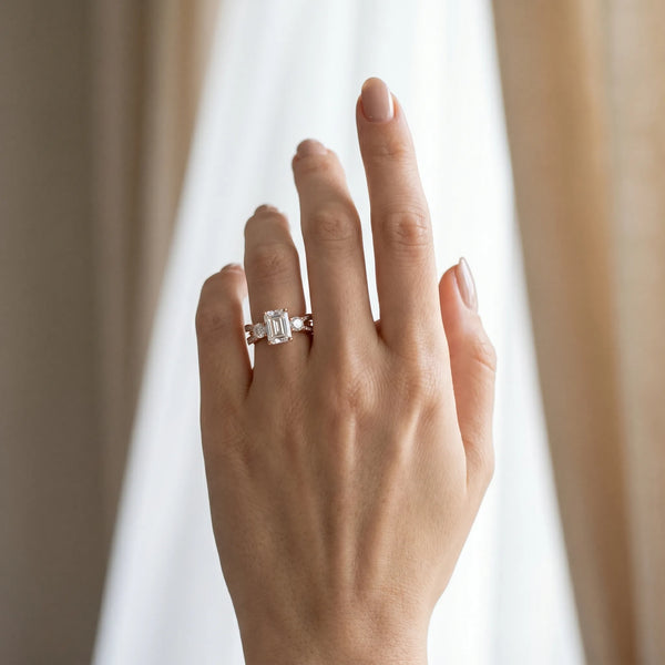 Rose gold Three-Stone Emerald Cut Diamond Twist Band with Prong Setting