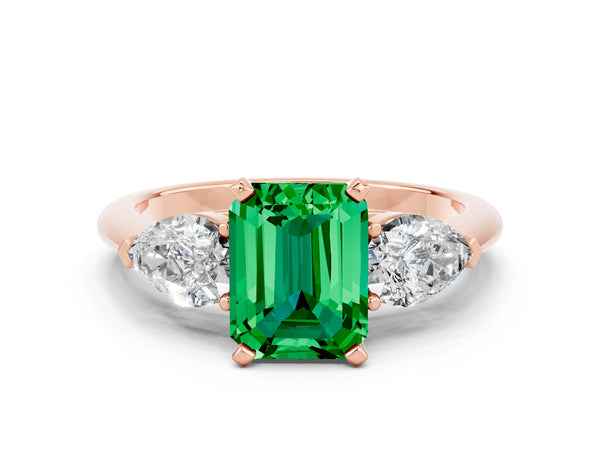 Rose gold Three-Stone Emerald Cut Emerald Ring with Pear Side Stones and Four-Prong Setting