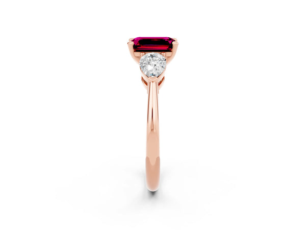 Rose gold Three-Stone Emerald Cut Garnet Ring with Pear Side Stones and Four-Prong Setting