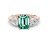 Rose gold Three-Stone Emerald Cut Green Sapphire Ring with Pear Side Stones and Four-Prong Setting