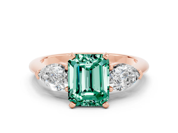 Rose gold Three-Stone Emerald Cut Green Sapphire Ring with Pear Side Stones and Four-Prong Setting