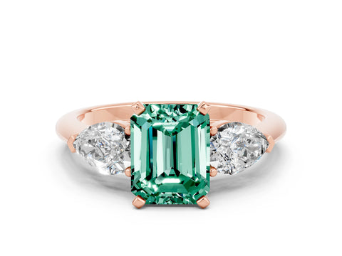 Rose gold Three-Stone Emerald Cut Green Sapphire Ring with Pear Side Stones and Four-Prong Setting