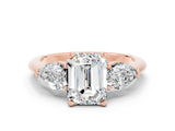 Rose gold Three-Stone Emerald Cut Moissanite Ring with Pear Side Stones and Four-Prong Setting