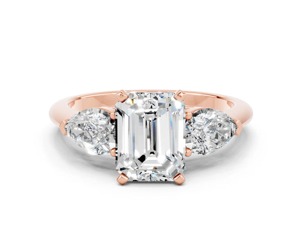 Rose gold Three-Stone Emerald Cut Moissanite Ring with Pear Side Stones and Four-Prong Setting