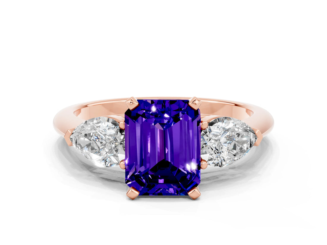 Rose gold Three-Stone Emerald Cut Tanzanite Ring with Pear Side Stones and Four-Prong Setting