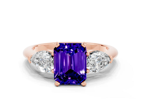 Rose gold Three-Stone Emerald Cut Tanzanite Ring with Pear Side Stones and Four-Prong Setting