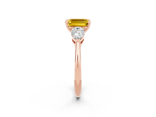 Rose gold Three-Stone Emerald Cut Yellow Sapphire Ring with Pear Side Stones and Four-Prong Setting