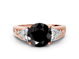Rose gold Three-Stone Fancy Black Round Cut Cut Diamond Ring with Trillion Side Stones on a Split Shank Band