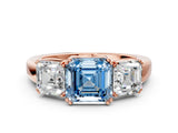 Rose gold Three-Stone Fancy Blue Asscher Cut Cut Diamond Ring with Channel Set Band and Four-Prong Setting