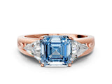 Rose gold Three-Stone Fancy Blue Asscher Cut Cut Diamond Ring with Trillion Side Stones on a Split Shank Band