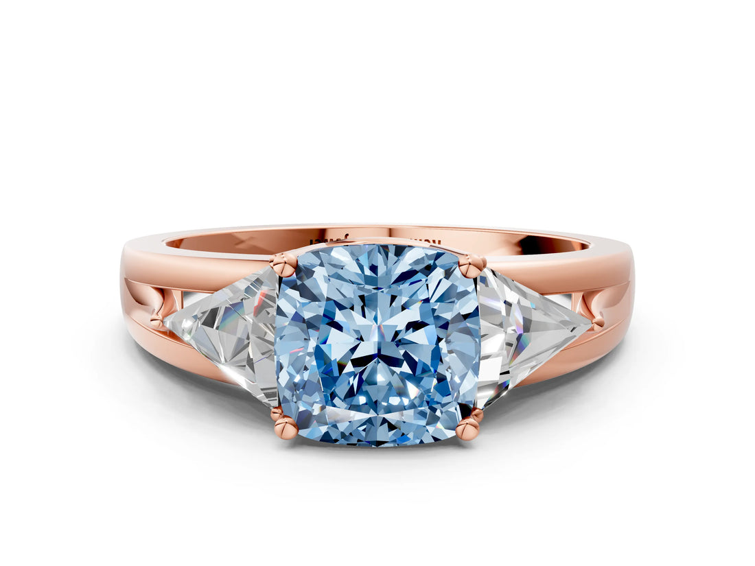 Rose gold Three-Stone Fancy Blue Cushion Cut Cut Diamond Ring with Trillion Side Stones on a Split Shank Band