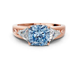 Rose gold Three-Stone Fancy Blue Cushion Cut Cut Diamond Ring with Trillion Side Stones on a Split Shank Band