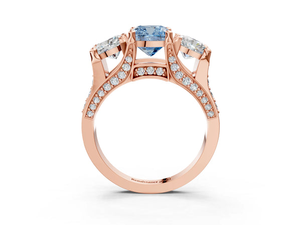 Rose gold Fancy Blue Cushion Cut Diamond Three-Stone Ring with Channel Set Band and Four-Prong Setting