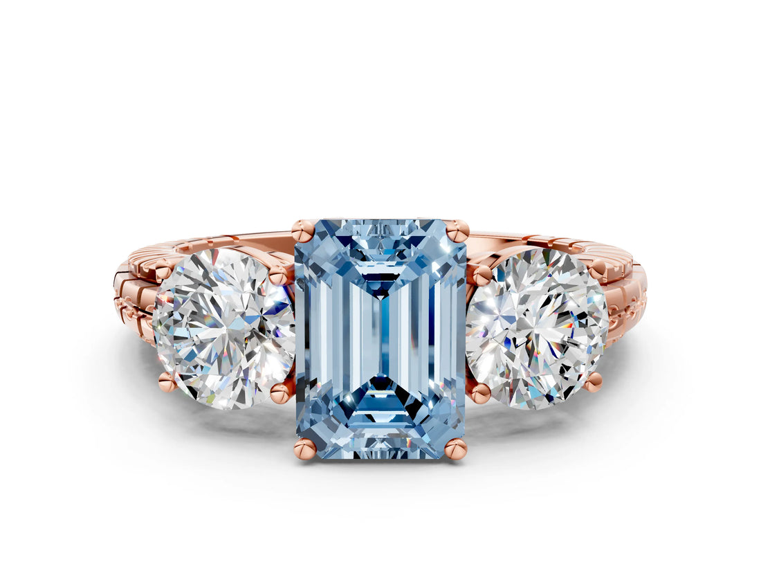 Rose gold Three-Stone Fancy Blue Emerald Cut Cut Diamond Ring with Channel-Set Band and Prong Setting