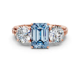 Rose gold Three-Stone Fancy Blue Emerald Cut Cut Diamond Ring with Channel-Set Band and Prong Setting
