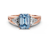 Rose gold Three-Stone Fancy Blue Emerald Cut Cut Diamond Ring with Trillion Side Stones on a Split Shank Band