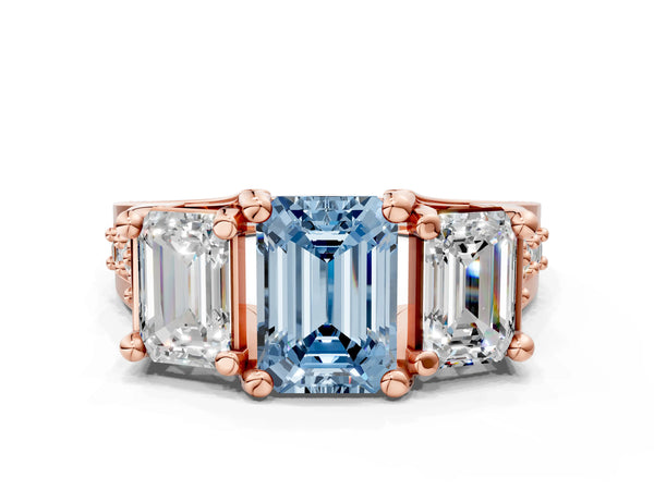 Rose gold Fancy Blue Emerald Cut Diamond Three-Stone Ring with Channel Set Band and Four-Prong Setting