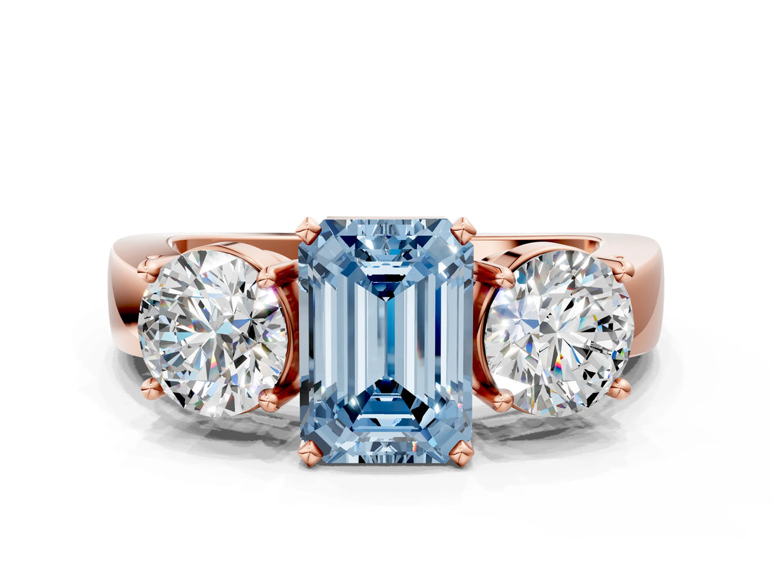 Rose gold Three-Stone Fancy Blue Emerald Cut Diamond Ring with Round Side Stones, Classic Band, and Four-Prong Setting