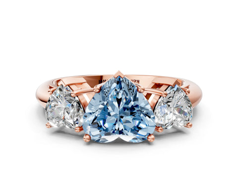 Rose gold Three-Stone Fancy Blue Heart Cut Cut Diamond Engagement Ring with Prong Setting on a White Gold Band