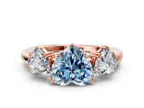 Rose gold Three-Stone Fancy Blue Heart Cut Cut Diamond Ring with Channel Set Band and Four-Prong Setting
