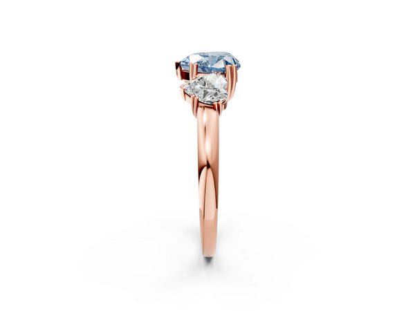 Rose gold Three-Stone Fancy Blue Heart Cut Cut Diamond Ring with Channel Set Band and Four-Prong Setting