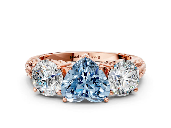 Rose gold Three-Stone Fancy Blue Heart Cut Cut Diamond Ring with Channel-Set Band and Prong Setting