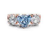 Rose gold Three-Stone Fancy Blue Heart Cut Diamond Ring with Round Side Stones, Classic Band, and Four-Prong Setting