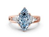Rose gold Three-Stone Fancy Blue Marquise Cut Cut Diamond Ring with Trillion Side Stones on a Split Shank Band