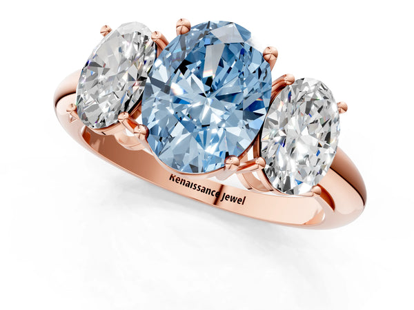 Rose gold Three-Stone Fancy Blue Oval Cut Cut Diamond Engagement Ring with Prong Setting on a White Gold Band