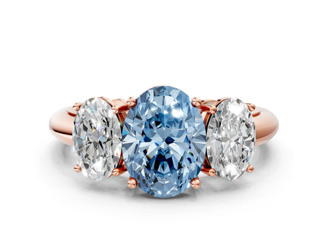 Rose gold Three-Stone Fancy Blue Oval Cut Cut Diamond Engagement Ring with Prong Setting on a White Gold Band