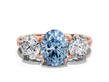 Rose gold Three-Stone Fancy Blue Oval Cut Cut Diamond Ring with Channel-Set Band and Prong Setting