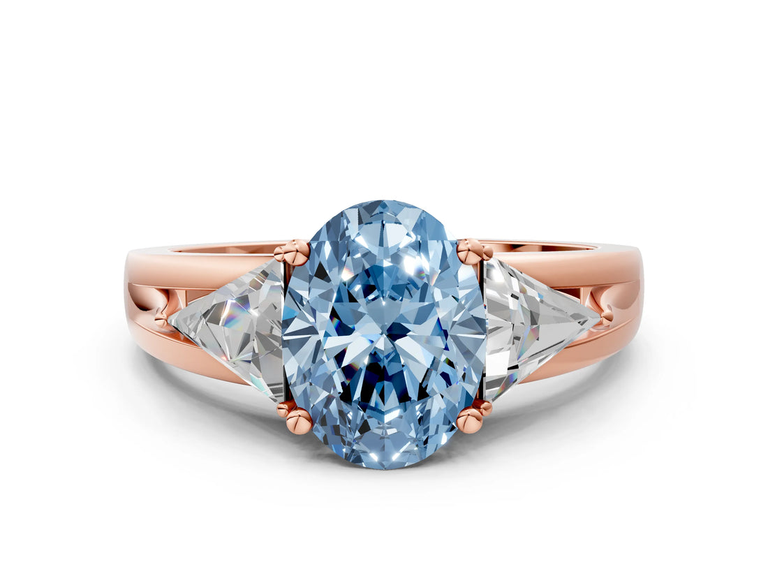 Rose gold Three-Stone Fancy Blue Oval Cut Cut Diamond Ring with Trillion Side Stones on a Split Shank Band