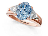 Rose gold Three-Stone Fancy Blue Oval Cut Cut Diamond Ring with Trillion Side Stones on a Split Shank Band_1