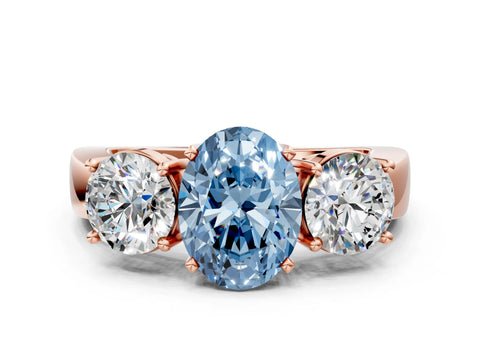 Rose gold Three-Stone Fancy Blue Oval Cut Diamond Ring with Round Side Stones, Classic Band, and Four-Prong Setting