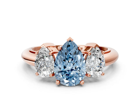 Rose gold Three-Stone Fancy Blue Pear Cut Cut Diamond Engagement Ring with Prong Setting on a White Gold Band