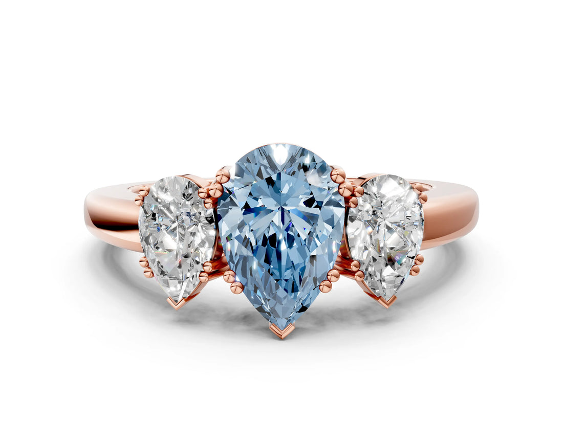 Rose gold Three-Stone Fancy Blue Pear Cut Cut Diamond Ring with Channel Set Band and Four-Prong Setting