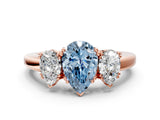 Rose gold Three-Stone Fancy Blue Pear Cut Cut Diamond Ring with Channel Set Band and Four-Prong Setting